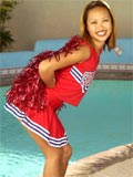 asian in a cheerleader uniform shows her tits and shaved pussy